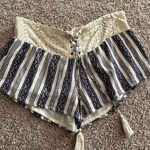 Rip Curl striped lace front shorts with tassel detail